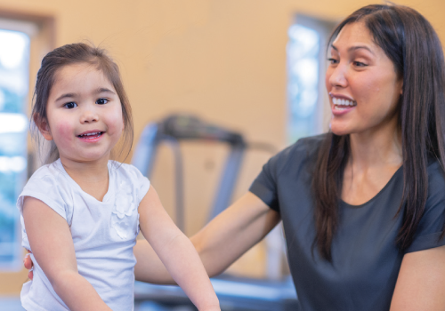 physical therapist working with a young girl