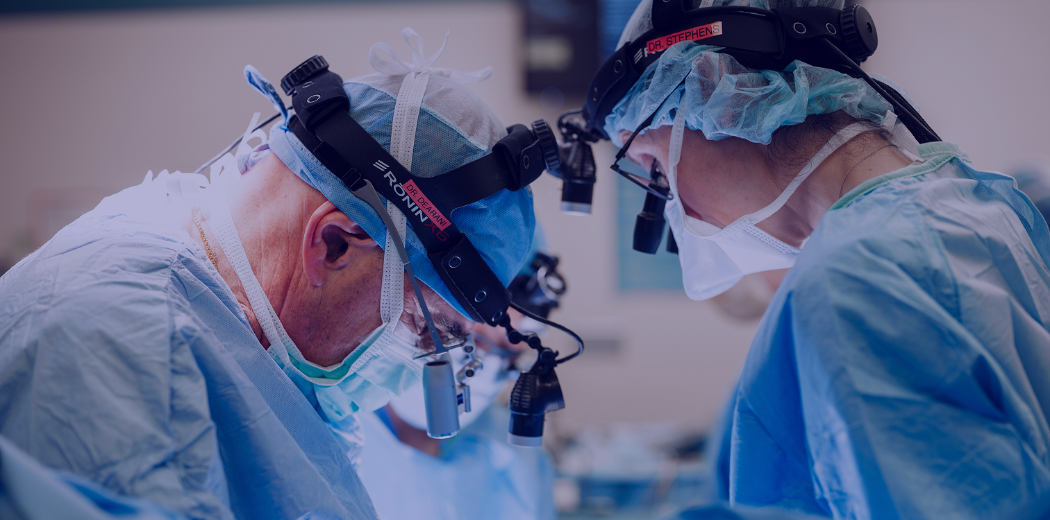 Two doctors looking down in an operating room