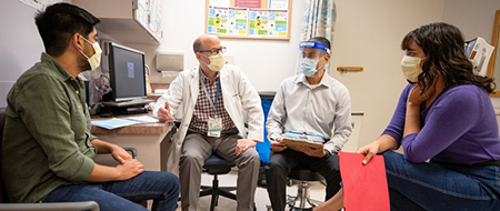 Clinical trial participants Daniel and Nina during an appointment.