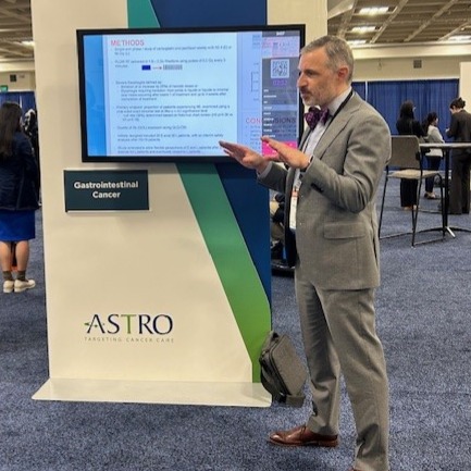 Joshua E. Meyer, MD, FASTRO, presenting his research at ASTRO 2025. 