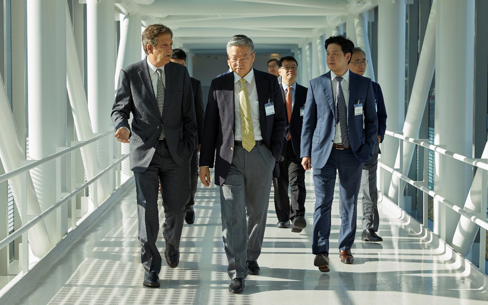 Cedars-Sinai Investigators and South Korean Healthcare and Business Leaders walking down a hallway