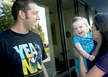 Sadie with her parents, Jon and Prudence.