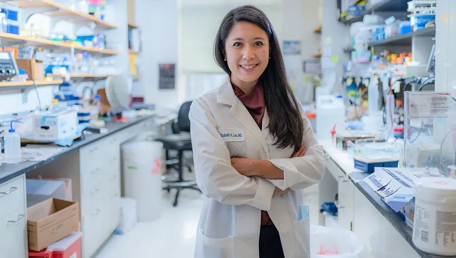 Medical oncologist and investigator Elizabeth Lee, MD, pictured in her lab, began at Dana-Farber as an early-career investigator.