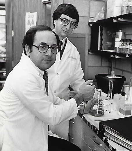 Stuart Orkin, MD (left), in his lab with the late Alan Michaelson, MD, in the early 1980s.